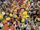 Brisk business: People busy buying flowers for Ayudha pooja at a market in the City on Friday. DH PHOTO