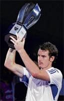 Triumphant: Britains Andy Murray shows off his spoils after winning the Shanghai Masters on Sunday. Reuters