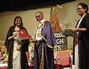 Proud: A student collecting her degree certificate.