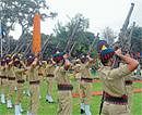 Police personnel firing in the air as part of Martyrs Day in Mysore on Thursday. DH Photo