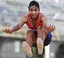 Golden Double: Praneetha Pradeep of Bethany High School leaps to the long jump gold in the Bangalore School Games at the Sree Kanteerava stadium on Thursday. DH Photo