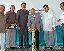 Federation of Karnataka Chamber of Commerce and Industries Chairman N S Srinivasmurthy inaugurating a meeting organised by District Commerce and Industries and interaction in Chamarajanagar on Wednesday. G R Ashwathnarayan, C V Srinivas Shetty and others are seen. DH Photo