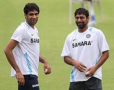 Indian bowlers Munaf Patel (L) and Praveen Kumar smile during a training session at the Jawaharlal Nehru cricket ground in Margao, Goa on Friday. India play the final One Day International cricket match against Australia in Goa on October 24. AFP PHOTO