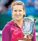 Victoria Azarenka with her prize after defeating Maria Kirilenko in the Kremlin Cup final on Sunday. AP