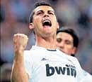 Cristiano Ronaldo of Real Madrid celebrates after scoring a goal against Racing Santander on Saturday. AP