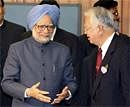 Indian Prime Minister Manmohan Singh, left, talks with Hiromasa Yonekura, chairman of Nippon Keidanren, or Japan Business Federation on his arrival for a luncheon hosted by Japanese business leaders to welcome Singh in Tokyo on Monday. AP Photo