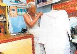 Viswanathan shows the special kurta at his shop in Pollachi in Coimbatore. Courtesy: Dinakaran Group
