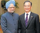 Prime Minister Manmohan Singh and his  China counterpart Wen Jiabao seen at a meeting in Thailand last year. The two leaders are scheduled to meet in Hanoi on Friday. AFP/ File Photo
