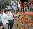 Deputy Commissioner, Harsh Gupta, Police Commissioner, Sunil Agarwal, MCC Commissioner, K S Raykar discussing a point near 101 Ganapathi Temple, in Mysore on Saturday.  DH photo