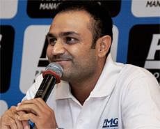 Cricketer Virender Sehwag interacts with the media at the Cricket Club of India (CCI) in Mumbai on Sunday. PTI Photo