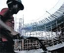 A construction worker at the site of the Fun Republic Mall, a new shopping mall being built in Coimbatore. NYT