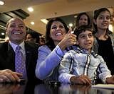 Republican candidate for South Carolina governor Nikki Haley, second from left, watches election results come in after the polls closed from a hotel restaurant with her husband Michael, from left, son Nalin, 9, and daughter Rena, 12, Tuesday in Columbia. AP