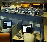 Employees at a call centre provide service support to international customers, in Bangalore. Reuters file photo