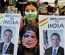 Peace activists paint their faces with India and US flags to welcome the US President Barack Obama in India, in Bhopal on Wednesday. PTI