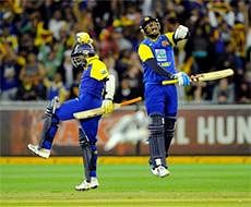 Sri Lanka's Muttiah Muralitharan, left, and Angelo Mathews celebrate after beating Australia in their one day international cricket match at the Melbourne Cricket Ground in Australia.  AP Photo