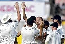 Wrecker-In-Chief: New Zealand pacer Chris Martin (centre) celebrates with team-mates after dismissing Indias Sachin Tendulkar on Sunday. AP