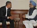 US President Barack Obama meets Prime Minister Manmohan Singh during a dinner hosted by the latter at his residence in New Delhi on Sunday. PTI