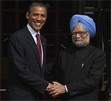 US President Barack Obama, left, is received by  Prime Minister Manmohan Singh, as he arrives for bilateral talks at the Hyderabad House in New Delhi. on Monday. AP