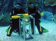 South African cricketer Morne Morkel (L) and Dale Steyn pose underwater with the ICC World Cup trophy, during a ceremony at the Dubai Mall aquarium on November 9, 2010, to mark the 100 days countdown to the event, to be hosted by India, Sri Lanka and Bangladesh -- the first time cricket's showpiece event is played in South Asia. AFP