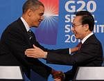US President Barack Obama, left, shakes hands with South Korea's President Lee Myung-bak during a joint press conference at the presidential Blue House in Seoul Thursday. AP