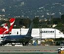 Qantas 767 turns back with engine problem