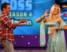 Former ''Baywatch'' star Pamela Anderson, right, dances with Bollywood actor Salman Khan on the sets of the Indian reality television show ''Big Boss'' in Mumbai, AP