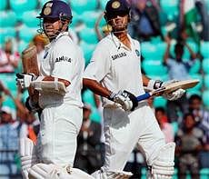 Sachin Tendulkar and Rahul Dravid run between the wickets to score a run on the second day of the 3rd and final cricket Test match against New Zealand at the VCA Ground in Nagpur on Sunday. PTI