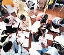 Workers for the Society for Social Audit, Accountancy and Transparency, sort through documents before a social audit, where villagers will discuss spending for the National Rural Employment Guarantee Act (NREGA) in Kurnool, Andhra Pradesh. NYT