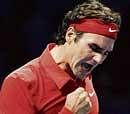 Swiss Master: Roger Federer celebrates his victory over Spaniard David Ferrer in London on Sunday. AP