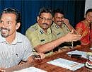 seminar: Police Commissioner Sunil Agarwal shares a lighter moment with Southern Range IGP A S N Murthy and Juvenile Justice Board Member P P Baburaj  at a workshop, in Mysore on Monday.  Childrens Rights Protection Commission Member Mamatha is also seen  DH PHOTO