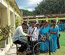 trial A trainee teacher tries out a machine to generate alternate renewable energy in Mysore. DH photo