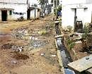 living conditions: The untarred road in Nimakallakunte layout. dh photo