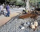 find the footpath Construction materials dumped on footpaths deprive the pedestrians of their space. DH Photo