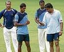Master and Pupil: Former India pace spearhead Javagal Srinath (right) offers tips to  Karnataka paceman A Mithun (centre) on Tuesday. DH photo/ Srikanta Sharma R