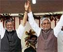The Power Duo : Newly sworn in Bihar Chief Minister Nitish Kumar and Deputy Chief Minister Sushil Kumar Modi wave after their swearing-in ceremony at the Gandhi Maidan in Patna on Friday. PTI