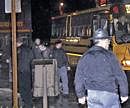 Marinette High School students step off a bus after being released on Monday, Wisconsin. A student armed with a handgun burst into a classroom at the end of the school day and held nearly two dozen students and a teacher hostage for more than five hours. AP