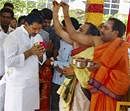 Andhra Pradesh Chief Minister Kiran Kumar Reddy seeks blessing from priests before taking charge at the state secretariat in Hyderabad on Wednesday. PTI Photo