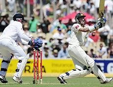 Australia's Mike Hussey, right, bats against England during the first day of their second Ashes cricket test in Adelaide. AP