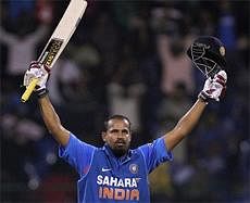 Yusuf Pathan celebrates his 100 runs during the 4th ODI cricket match against New Zealand at Chinnaswamy Stadium in Bangalore on Tuesday. AP