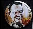 Badge with a likeness of jailed Nobel Peace Prize winner Chinese dissident Liu Xiaobo. AP