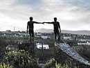 SYMBOLIC  Hands Across The Divide, a bronze sculpture which depicts the spirit of  reconciliation of Derry. Photos by author