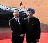 Indian Prime Minister Manmohan Singh, right, welcomes Chinese Premier Wen Jiabao as the latter arrives for a ceremony at the Rashtrapati Bhavan, or the Presidential Palace, in New Delhi, India, Thursday, Dec. 16, 2010.  AP