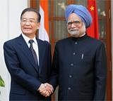 Chinese Prime Minister Wen Jiabao (L) shakes hands with India Prime Minister Manmohan Singh (R) prior to a meeting in New Delhi on December 16, 2010.  AFP