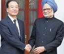 Prime Minister Manmohan Singh shakes hands with Chinese Premier Wen Jiabao during a meeting at Hyderabad House in New Delhi on Thursday. PTI