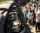 Sonitpur: People watch derailed coaches of Arunachal Express train at Dubia near Gahpur in Sonitpur district of Assam on Friday. PTI Photo