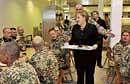 Surprise visit: German Chancellor Angela Merkel having lunch with German soldiers during an unannounced visit to the  German Armys base in the northern Afghan city of Kunduz on Saturday. AFP
