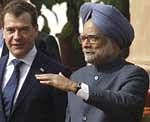 Russian President Dmitry Medvedev and Indian Prime Minister Manmohan Singh walk after talks in New Delhi, on Tuesday. AP Photo/RIA Novosti, Dmitry Astakhov, Presidential Press Service)
