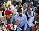 Col (retd) Kiroi Singh Bainsala (in red turban), President of the Rajasthan Gujjar Aarakshan Sangarsh Samiti, talks to the media during a Gujjar agitation in Bharatpur district of Rajasthan on Monday. PTI