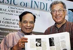 Posterity beckons: Renowned Carnatic vocalist and composer M  Balamuralikrishna presents The Oxford Encyclopedia of the Music of India to noted playwright and actor Girish Karnad during its release function in Chennai on Thursday. PTI