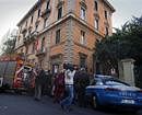 Police officers and a firefighter vehicle are parked outside the Chilean embassy, in Rome, Thursday, Dec. 23, 2010. A pair of package bombs exploded at the Swiss and Chilean embassies in Rome on Thursday, injuring the two people who opened them, officials said. Police ordered checks at all embassies after a false alarm was also reported at the Ukrainian embassy. (AP Photo/Angelo Carconi)